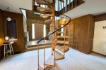 Very cool spiral staircase leading to two bedrooms upstairs. 